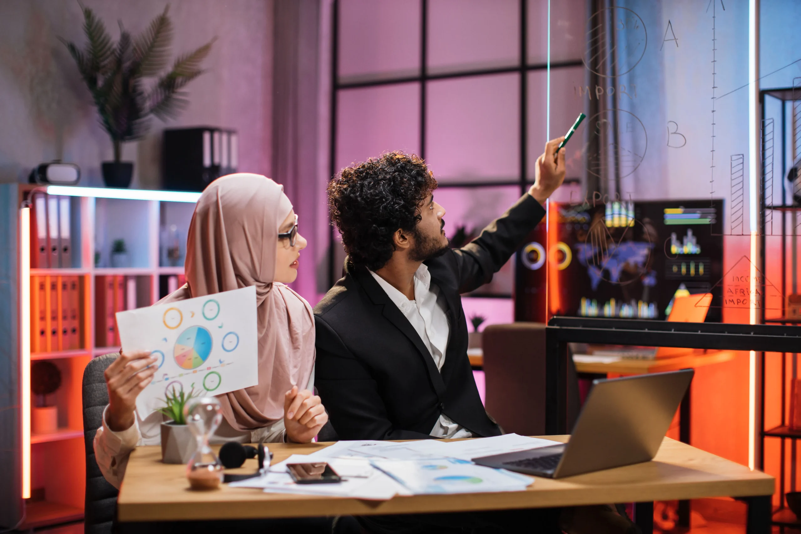 smart-bearded-male-office-manager-and-muslim-femal-2024-12-13-05-49-30-utc